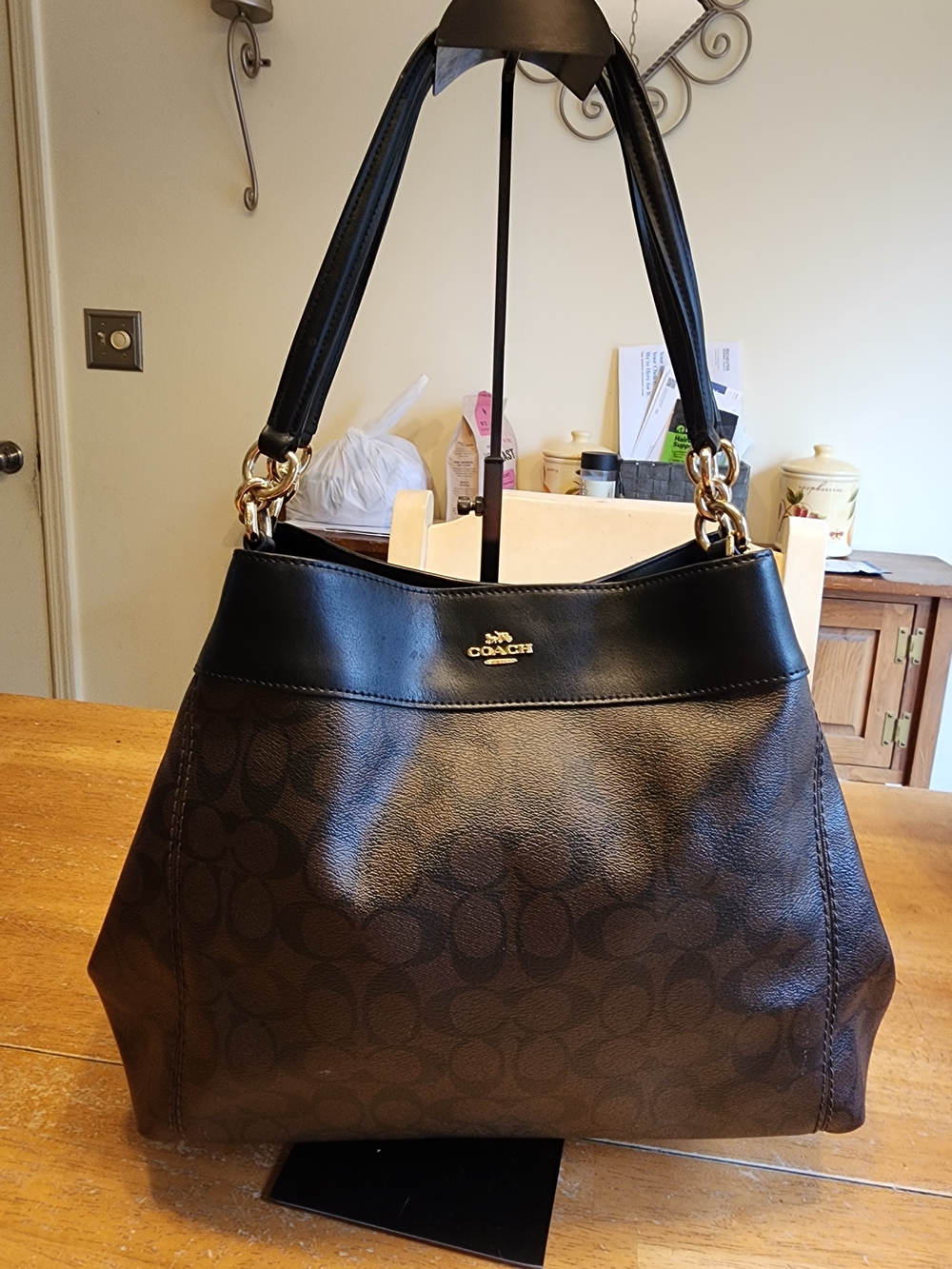 brown and black Coach Large Lexy Shoulder Bag in Signature Canvas